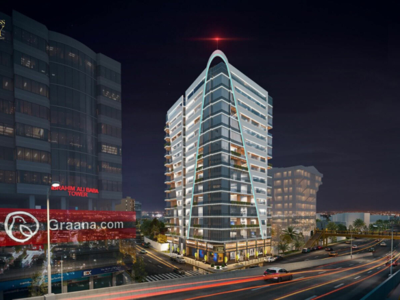 Business Bay office tower on Shahra-e-Faisal, Karachi, modern curved glass high-rise at night with urban lights and traffic