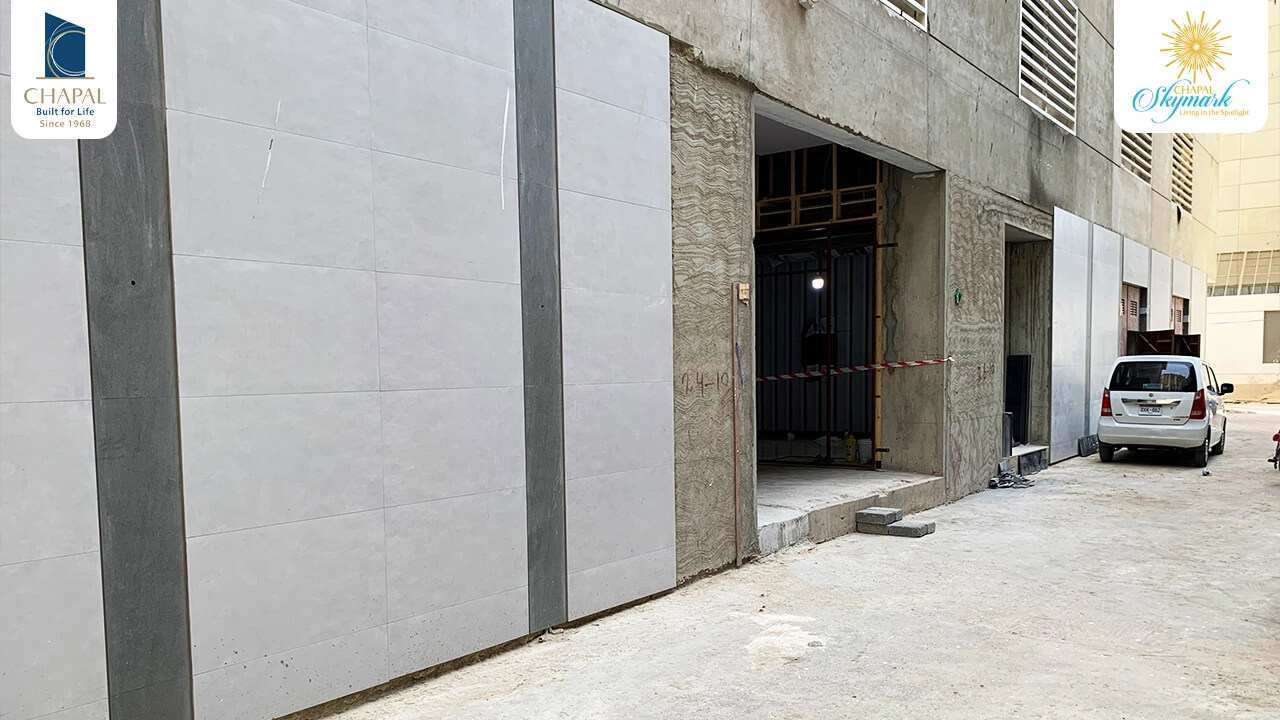 Chapal Skymark 50-storey tower construction site with concrete walls, panels, and open entrance framing