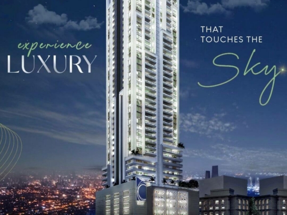 Chapal Skymark 50-storey luxury tower glowing at dusk with city skyline backdrop