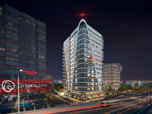 Business Bay office tower on Shahra-e-Faisal, Karachi, modern curved glass high-rise at night with urban lights and traffic